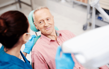 Nervous patient receiving dental treatment
