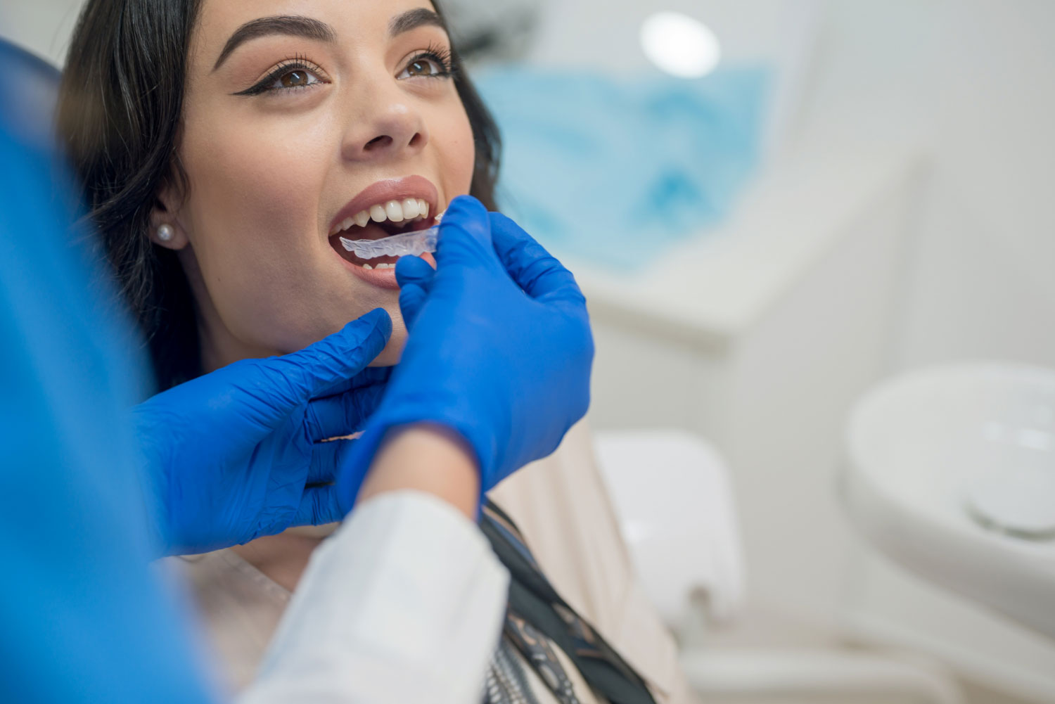 Black haired women having her Invisalign Braces tested at Wolverhampton dental practice