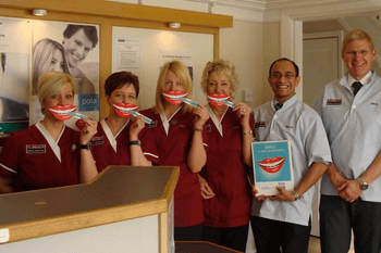 Claregate dental practice team in Wolverhampton with smile mask