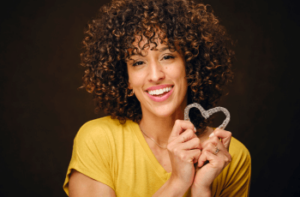 Woman with invisible braces in Wolverhampton dental practice smiling