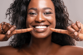 woman in Wolverhampton dental practice pointing at Invisalign teeth