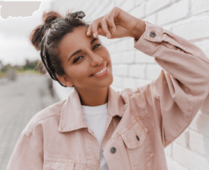 woman smiling with invisalign braces from claregate dental