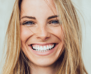 woman smiling with straight teeth after Invisalign treatment in wolverhampton