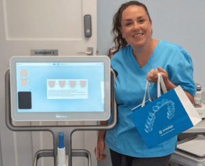 Member of the team at claregate dental practice showing you invisalign products