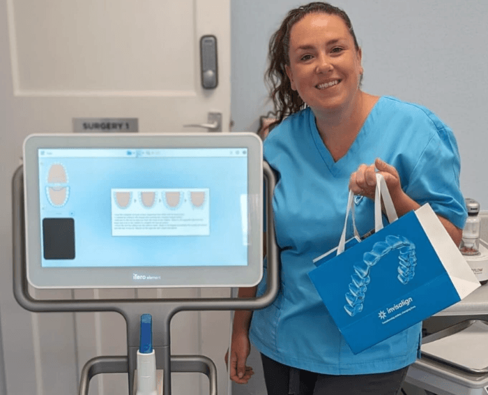 Member of the team at claregate dental practice showing you invisalign products