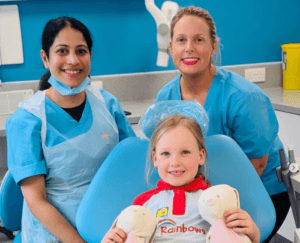 Our dental team with a young girl at claregate dental