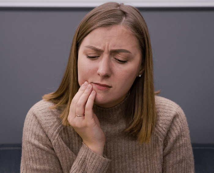 Woman before root canal treatment